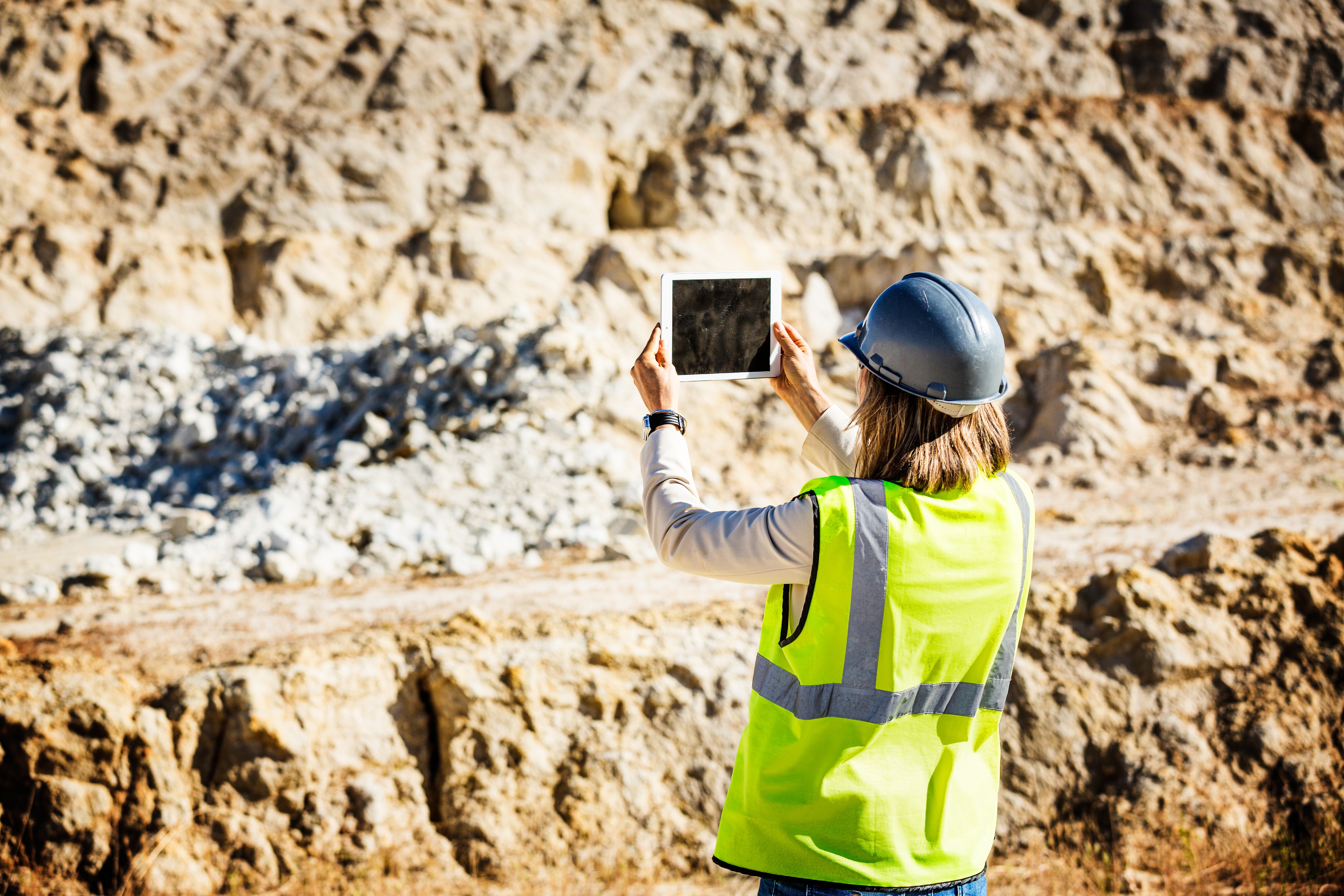 Miner uses a tablet.